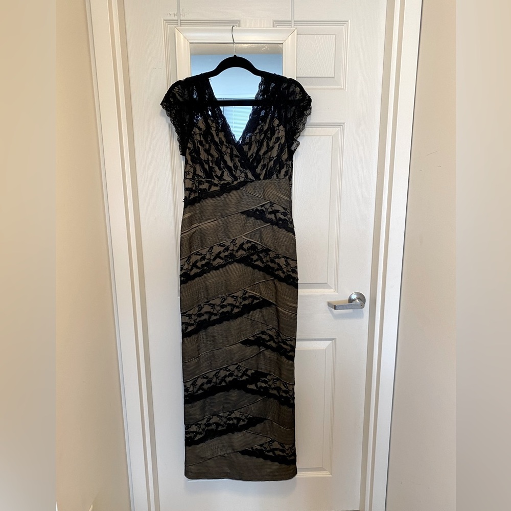 Marina floor length gown with lace and beading. Black and gold. Size 12.